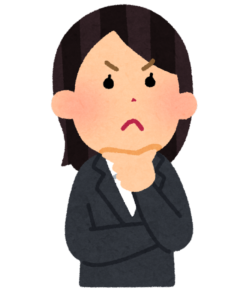 考えるスーツの女性