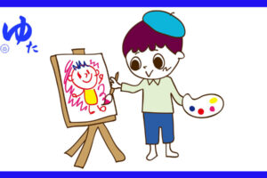 キャンパスに絵を描く少年