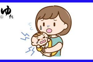 泣いている赤ちゃんをあやすお母さん