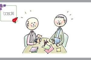 折り紙を折る、高齢の男性2人
