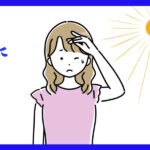 強い日差しに疲れている女性