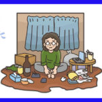 散らかった部屋で一人座っている男性