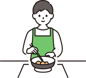 フライパンでいためている男性
