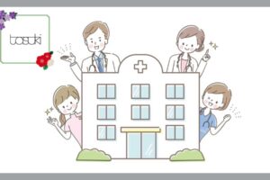 病院を囲む、4人の医師と看護師の男女