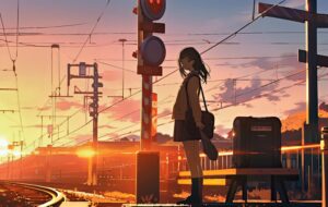 夕焼けの線路に佇む女の子