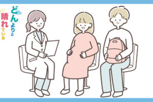 女医の診察を受ける妊婦とその夫