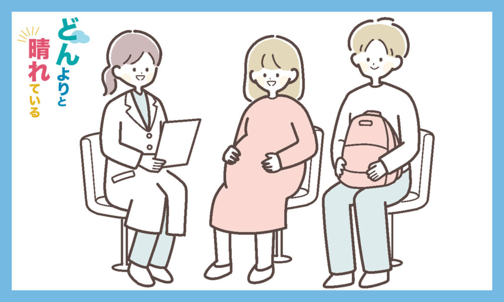 女医の診察を受ける妊婦とその夫