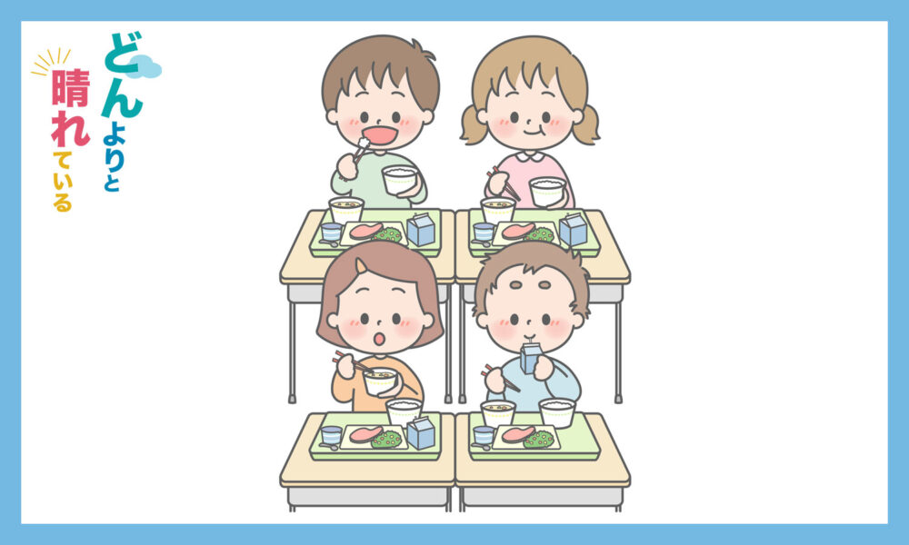 一方の方向を向いて給食を食べている児童4人