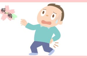 腰の痛みで冷や汗をかく男性の画像