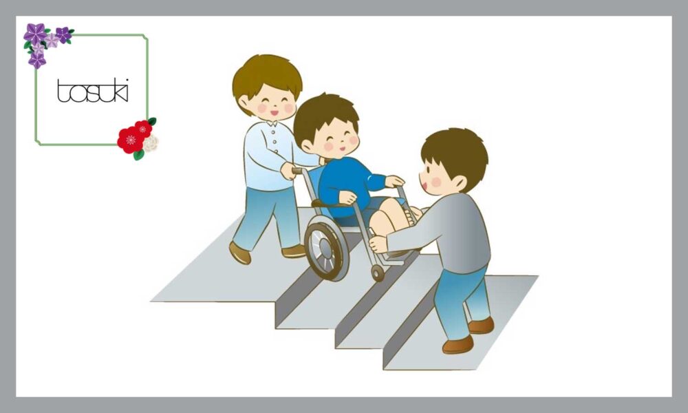 車椅子の男の子を配慮する、二人の男の子