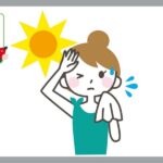 汗をタオルで拭く女性
