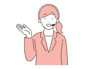 ヘッドセットをつけた女性オペレーターが、笑って話している。