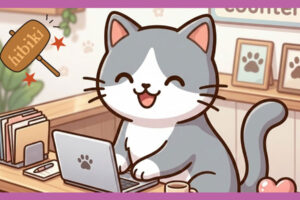 カウンターでパソコンを打つ猫。わらっている。